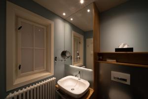 Koupelna v ubytování Carl.22 City Appartements + 12 fotografií