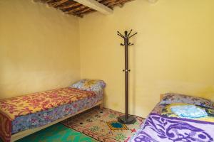Un ou plusieurs lits dans un hébergement de l'établissement Gite Nait Youssef Taghia