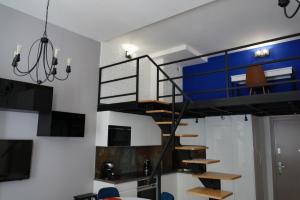 Televízia a/alebo spoločenská miestnosť v ubytovaní Sienkiewicza Loft1