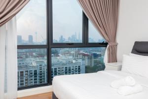 Katil atau katil-katil dalam bilik di Velocity KL By PSM Luxury Suites