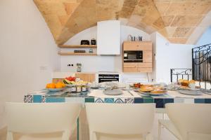 a kitchen with a table with fruit on it at Samarés in Ciutadella