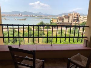 a balcony with a view of the water at B&B Da Lucina in Olbia