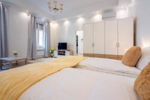 Posteľ alebo postele v izbe v ubytovaní Town Hall Apartment