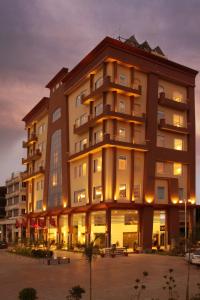 a large building with lights on in front of it at HK Clarks Inn, Amritsar in Amritsar