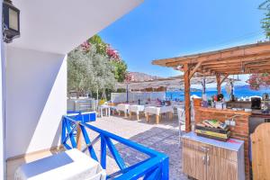 a view of a patio with a table and chairs at Anfora Hotel in Bozburun