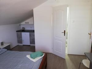 Postel nebo postele na pokoji v ubytování S. A. L. Prenociste