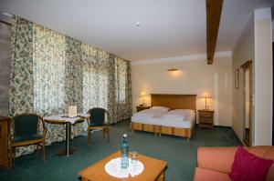 Postel nebo postele na pokoji v ubytování Hotel Ansitz Kematen ***S