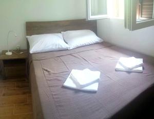 Ein Bett oder Betten in einem Zimmer der Unterkunft Stipina Villa Zadar County
