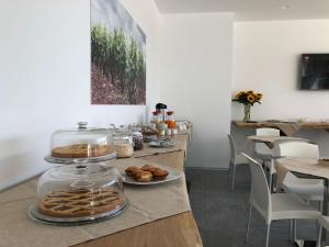 a table with a display of pastries on it at terra di negroamaro in Leverano