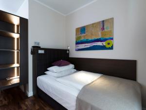 Posteľ alebo postele v izbe v ubytovaní Hotel Sandwirth