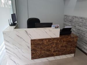 an office cubicle with a marble counter top at Global Residency in Kota Kinabalu