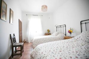 Postel nebo postele na pokoji v ubytování Cortijo El Derramadero