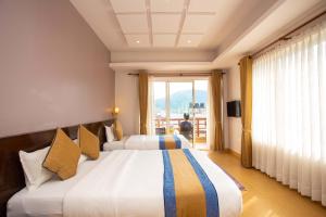 Ένα ή περισσότερα κρεβάτια σε δωμάτιο στο Hotel Lake Paradise
