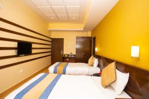 Un pat sau paturi într-o cameră la Hotel Lake Paradise