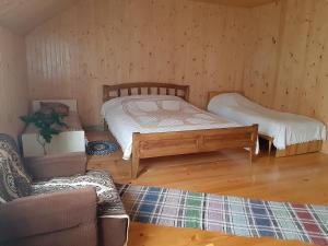 Postel nebo postele na pokoji v ubytování WoodDream