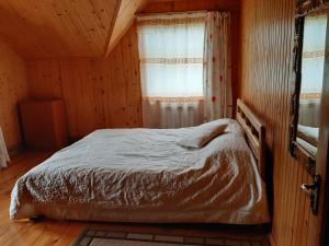 Postel nebo postele na pokoji v ubytování WoodDream