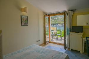 Postel nebo postele na pokoji v ubytování Hotel Baja Romantica