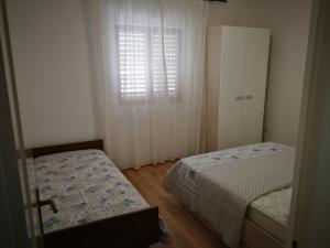 Posteľ alebo postele v izbe v ubytovaní Vukotić Beach house