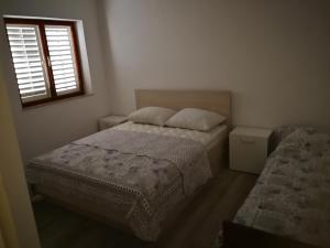 Posteľ alebo postele v izbe v ubytovaní Vukotić Beach house