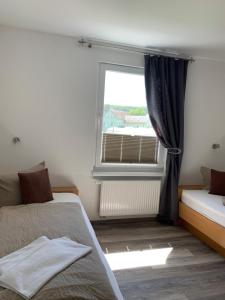 Letto o letti in una camera di Hotel Bannewitz B&B