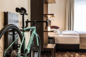 Posteľ alebo postele v izbe v ubytovaní Hotel Sandwirth