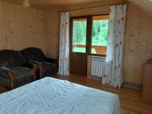 Postel nebo postele na pokoji v ubytování WoodDream