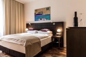 Posteľ alebo postele v izbe v ubytovaní Hotel Sandwirth