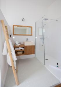 a bathroom with a shower and a sink at L’Ostréale in La Tremblade +27 photos