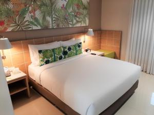 Mia Hotel Choco客房内的一张或多张床位