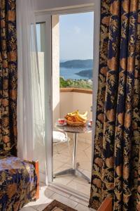 a room with a table with bananas on a balcony at " Villa Kruna Lux " in Budva