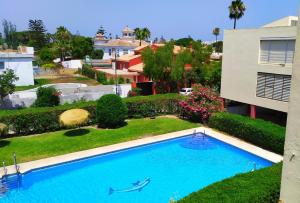 an overhead view of a swimming pool in a yard at Apartamento Chay in Málaga