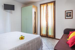 A bed or beds in a room at Residence Nuove Terme
