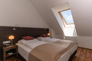 Posteľ alebo postele v izbe v ubytovaní Hotel Sandwirth