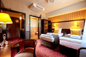 Posteľ alebo postele v izbe v ubytovaní Hotel Wielopole