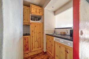 Kuchyň nebo kuchyňský kout v ubytování Residences Quartier Falaise - maeva Home
