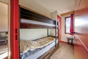 Postel nebo postele na pokoji v ubytování Residences Quartier Falaise - maeva Home