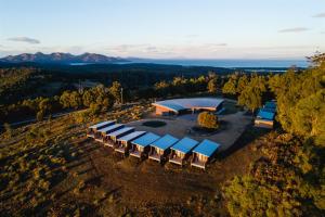 an overhead view of a building with a group of tables at Freycinet Resort in Coles Bay
