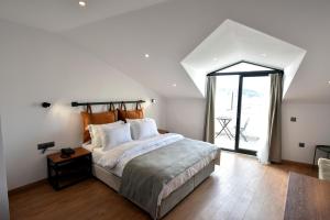 A bed or beds in a room at La Farine Rooms