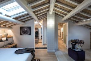 a bedroom with a bed and a vaulted ceiling at Laurina 33 in Rome