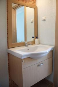 a bathroom with a sink and a mirror at On Hotel in Adrasan