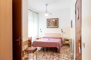 Postel nebo postele na pokoji v ubytování Villa Rosy