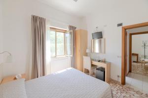 Postel nebo postele na pokoji v ubytování Villa Rosy