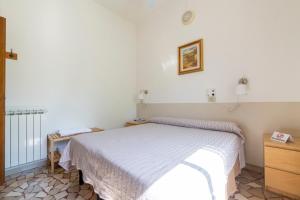 Postel nebo postele na pokoji v ubytování Villa Rosy