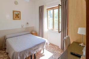 Postel nebo postele na pokoji v ubytování Villa Rosy