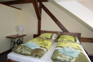Postel nebo postele na pokoji v ubytování Hotel Pudlov