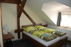 Postel nebo postele na pokoji v ubytování Hotel Pudlov