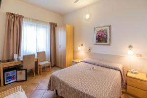 Postel nebo postele na pokoji v ubytování Villa Rosy