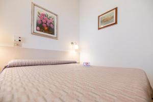 Postel nebo postele na pokoji v ubytování Villa Rosy