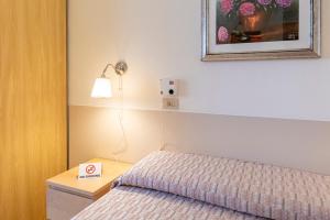 Postel nebo postele na pokoji v ubytování Villa Rosy