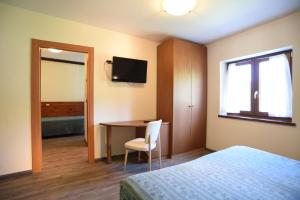 Postel nebo postele na pokoji v ubytování Albergo Bucaneve
